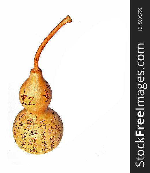 Bottle gourd with chinese characters on it.