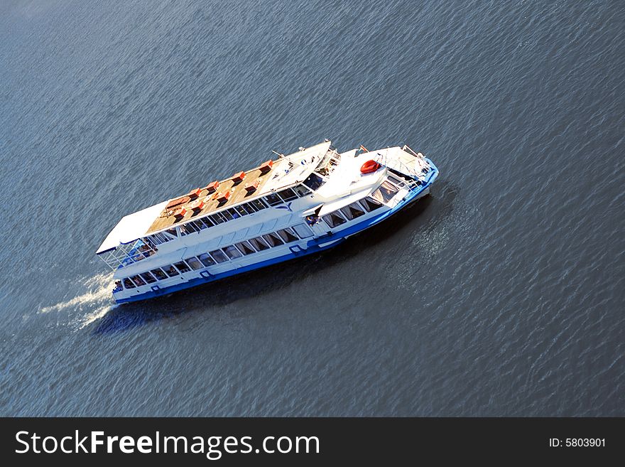 White cruise ship and calm sea.