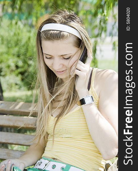 Young girl talking by phone