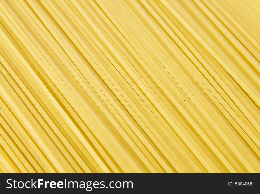 Background of yellow long spaghetti. Background of yellow long spaghetti