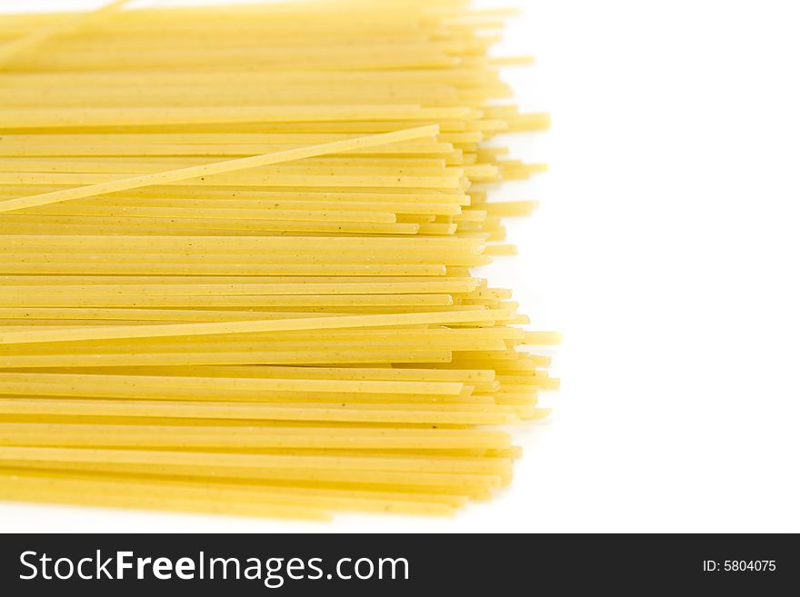 Some yellow macaroni isolated on white