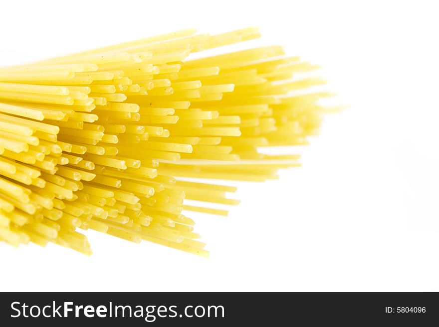 Some yellow macaroni isolated on white