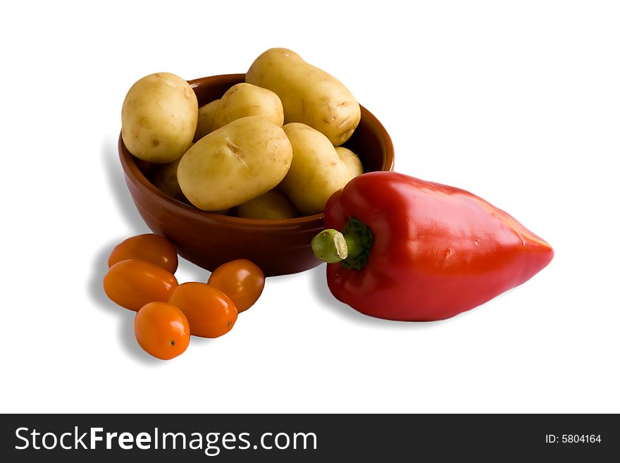 Potatoes, orange tomatoes and red pepper. Potatoes, orange tomatoes and red pepper