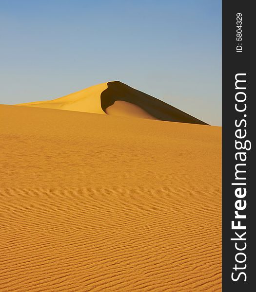 Over centuries, gentle winds shape the Desert Dune