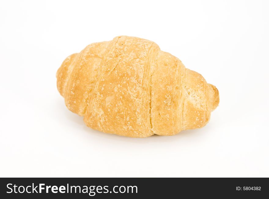 One croissant isolated on white