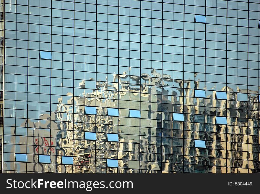 China, modern Chinese skyscrapers in reflection from glass panel of exhibition center. China, modern Chinese skyscrapers in reflection from glass panel of exhibition center.