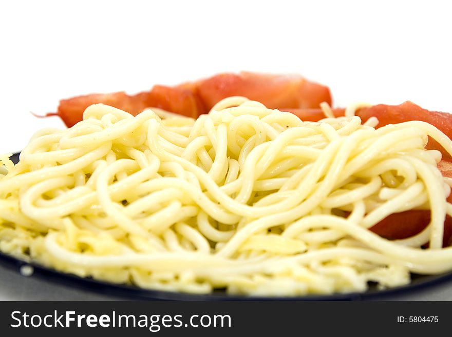 Macaroni with tomatoes on plate