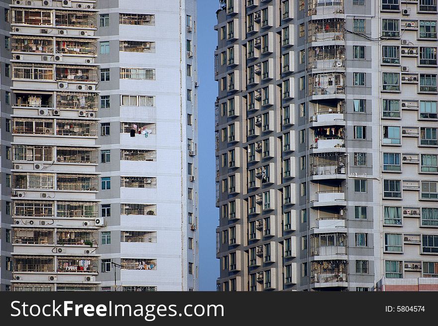 China, modern Chinese residential buildings with small gap between, hundreds of balconies and windows. China, modern Chinese residential buildings with small gap between, hundreds of balconies and windows.