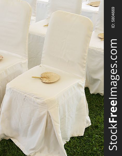 Chair with a fan at a wedding ceremony. Chair with a fan at a wedding ceremony.
