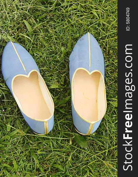 Pair of blue and gold Indian style shoes. Pair of blue and gold Indian style shoes.