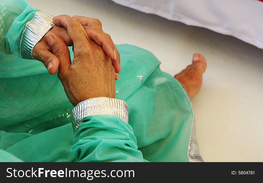 Close-up of a woman's hands at a traditional Indian wedding ceremony. Close-up of a woman's hands at a traditional Indian wedding ceremony.