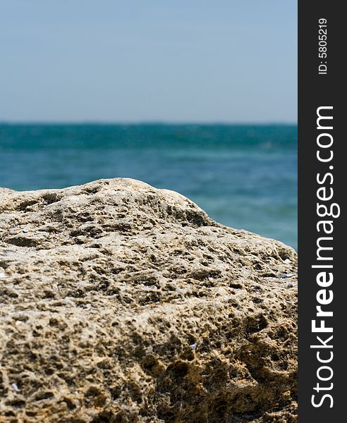 Detail of rocky cliff and beautiful blue sea. Detail of rocky cliff and beautiful blue sea