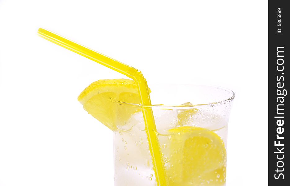 Cold drink with ice and lemons isolated