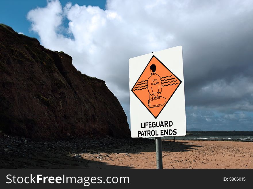 A sign warning that there is no lifeguard patrol beyond this sign. A sign warning that there is no lifeguard patrol beyond this sign