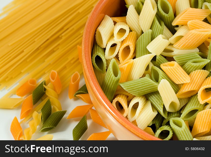 Close-up of pasta in bowl on white background