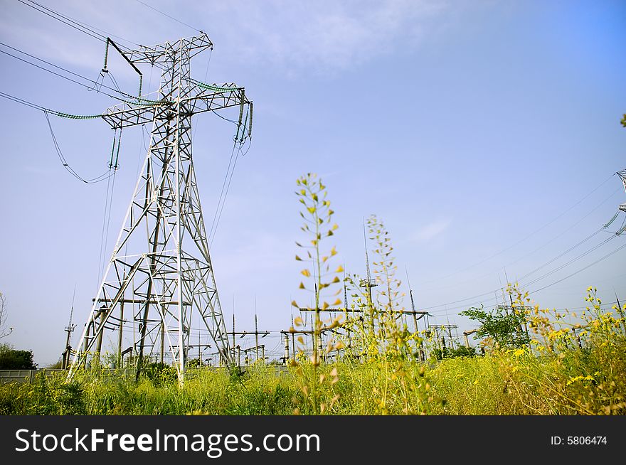 Electrical towers on blue sky background