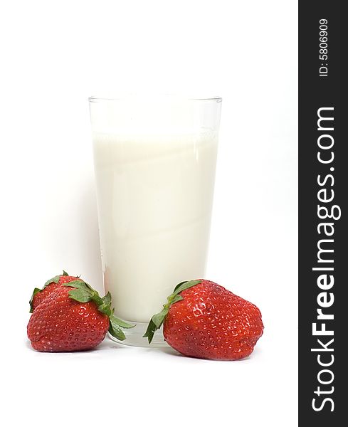 Glass of milk and strawberries