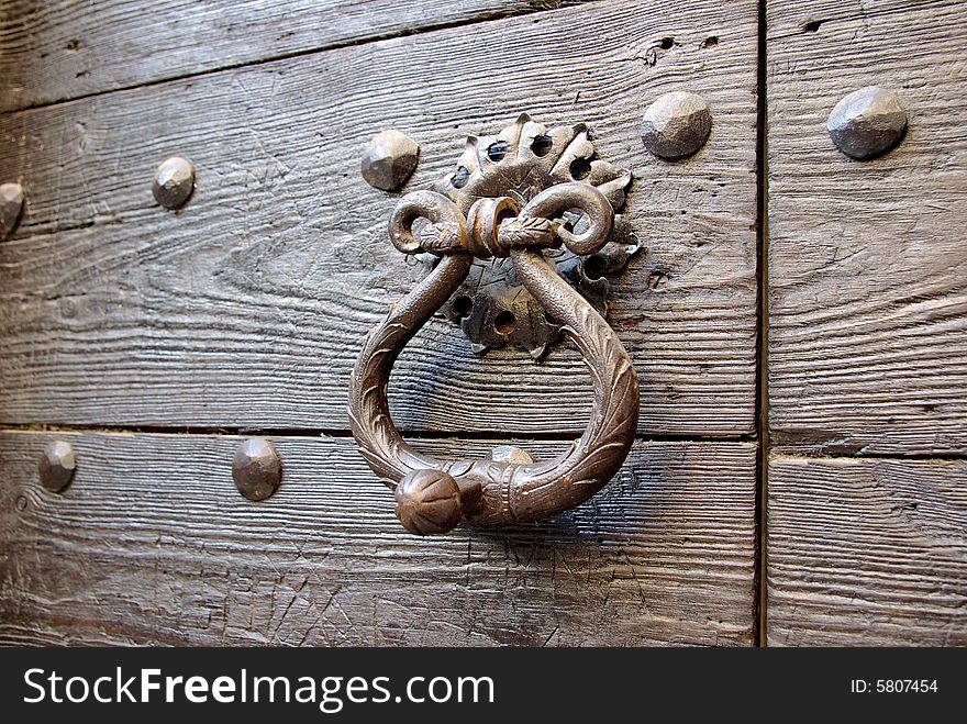 Detail of an ancient wooden door. Detail of an ancient wooden door.