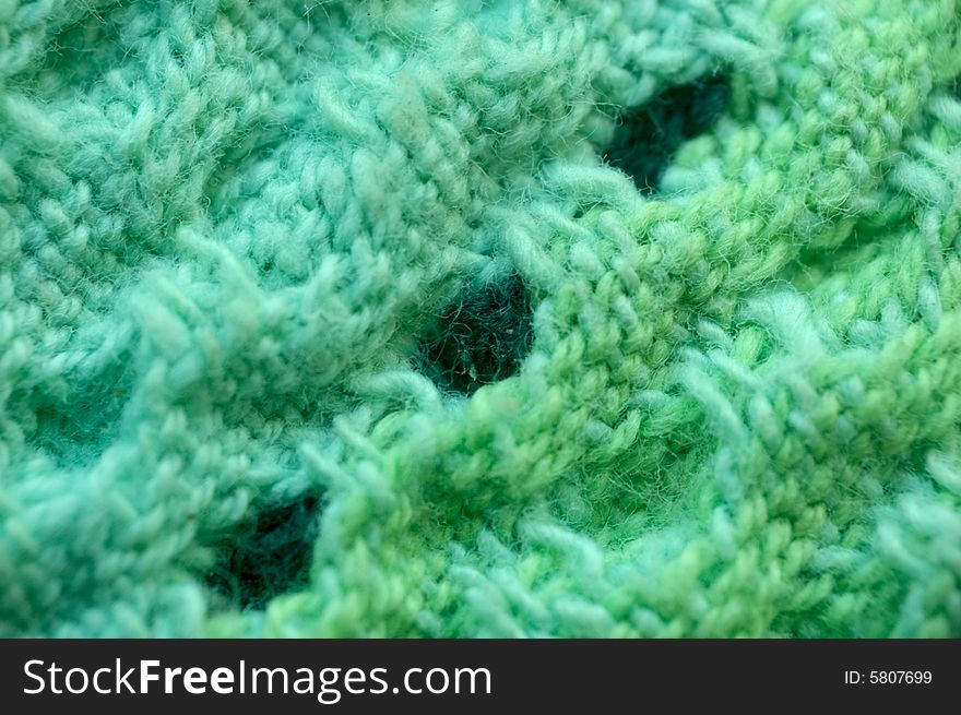 Macro pattern of green - light-blue textile fabric