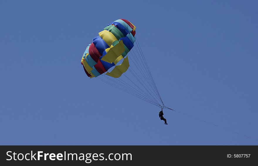 Tourist flying on  draged parachute. Tourist flying on  draged parachute