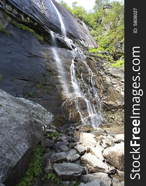 A waterfall by Chimney rock, NC, that is photographed with a slower shutter speed.