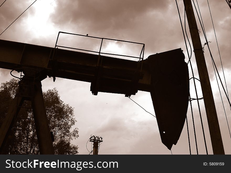 Sepia of an abandoned oil-derrick