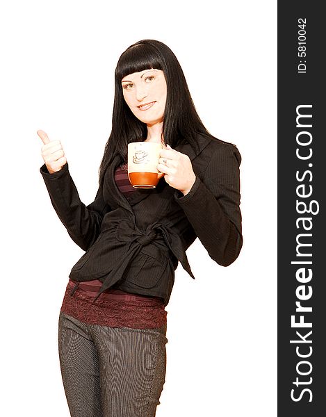 A young pretty businesswoman standing in a studio with a coffee cup in
her hand and having fun. A young pretty businesswoman standing in a studio with a coffee cup in
her hand and having fun.