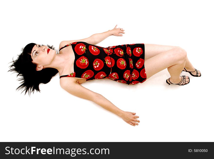 A young pretty woman lying on the floor and having fun
in her tomato printed dress, for white background. A young pretty woman lying on the floor and having fun
in her tomato printed dress, for white background.