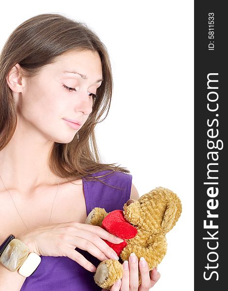 Portrait of a beautiful lady holding teddy-bear on white background. Portrait of a beautiful lady holding teddy-bear on white background