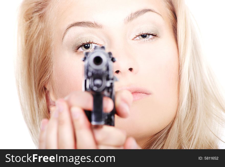 Portrait of a lovely lady with a gun aiming at you on white background. Portrait of a lovely lady with a gun aiming at you on white background