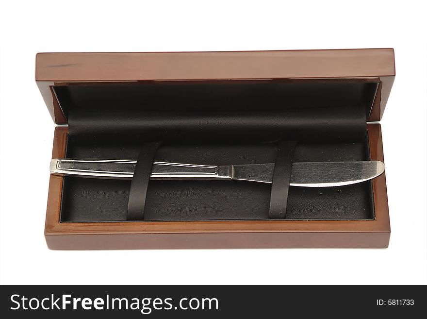 Iron knife in a wooden box. Iron knife in a wooden box