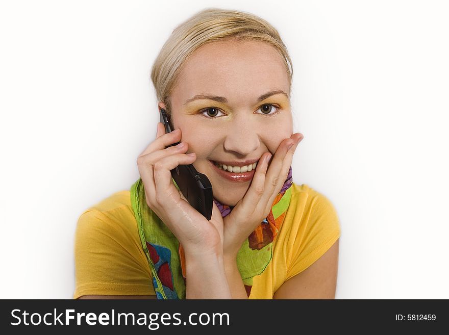 Smiling female using mobile phone; white background. Smiling female using mobile phone; white background