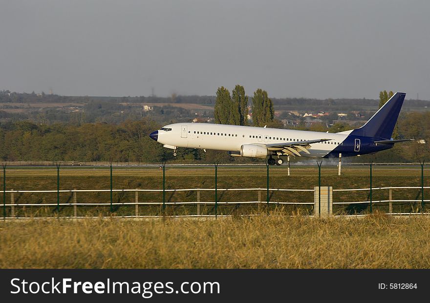 Plane touching ground on the runway. Plane touching ground on the runway