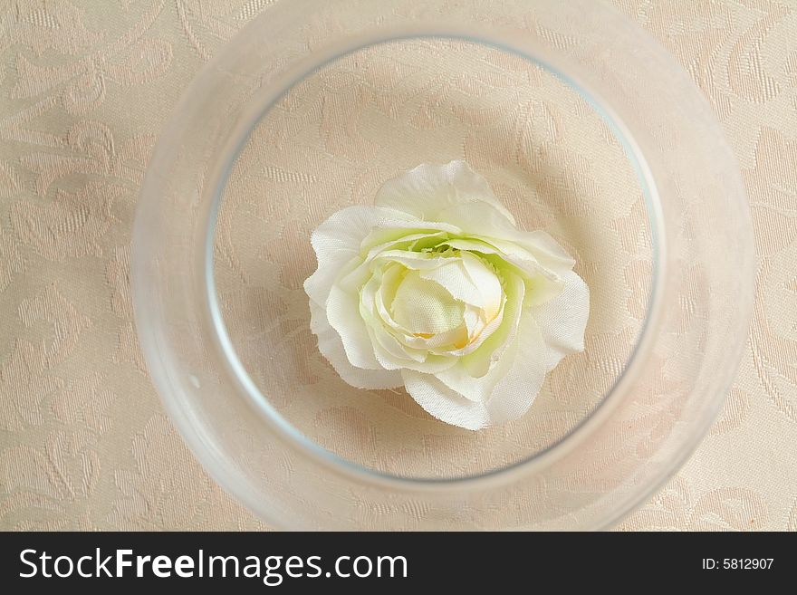 Artificial flower in glass to a cup