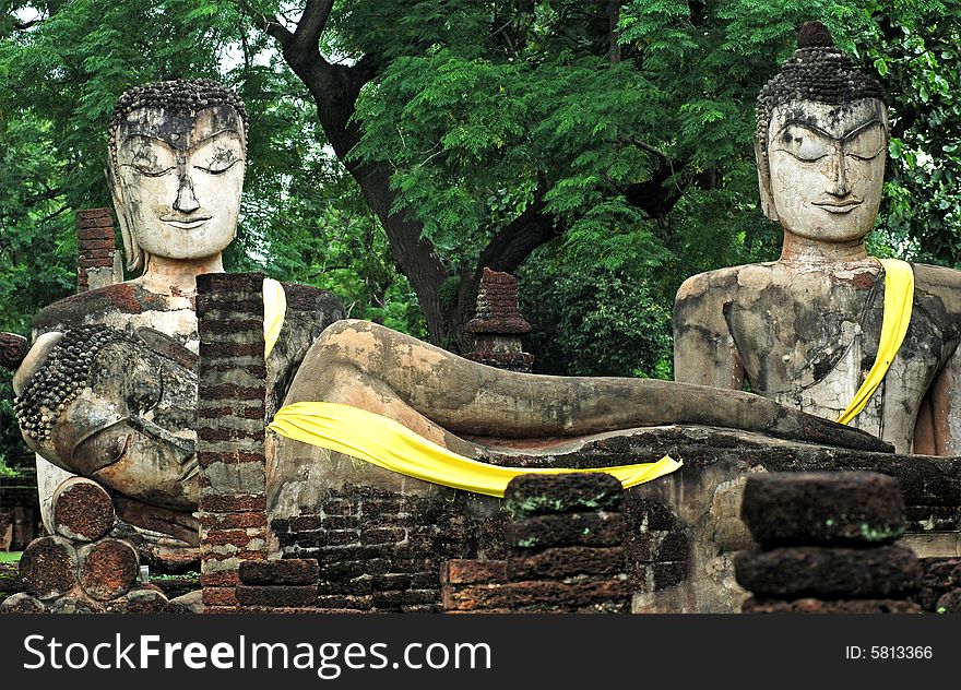 Thailand, KAMPHAENG PHET:the historical park is situated in the north of the country. View of one seated and one reclining Buddhas. Thailand, KAMPHAENG PHET:the historical park is situated in the north of the country. View of one seated and one reclining Buddhas