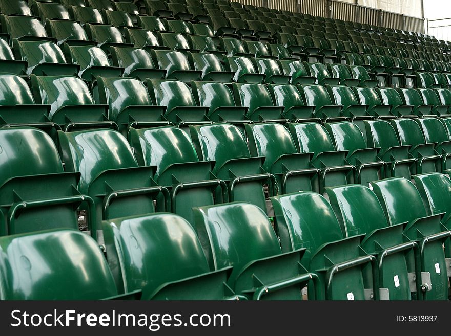 Rows of green stadium seats