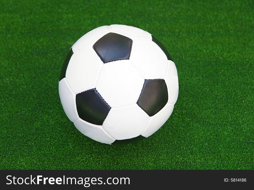 Football ball in the green grass