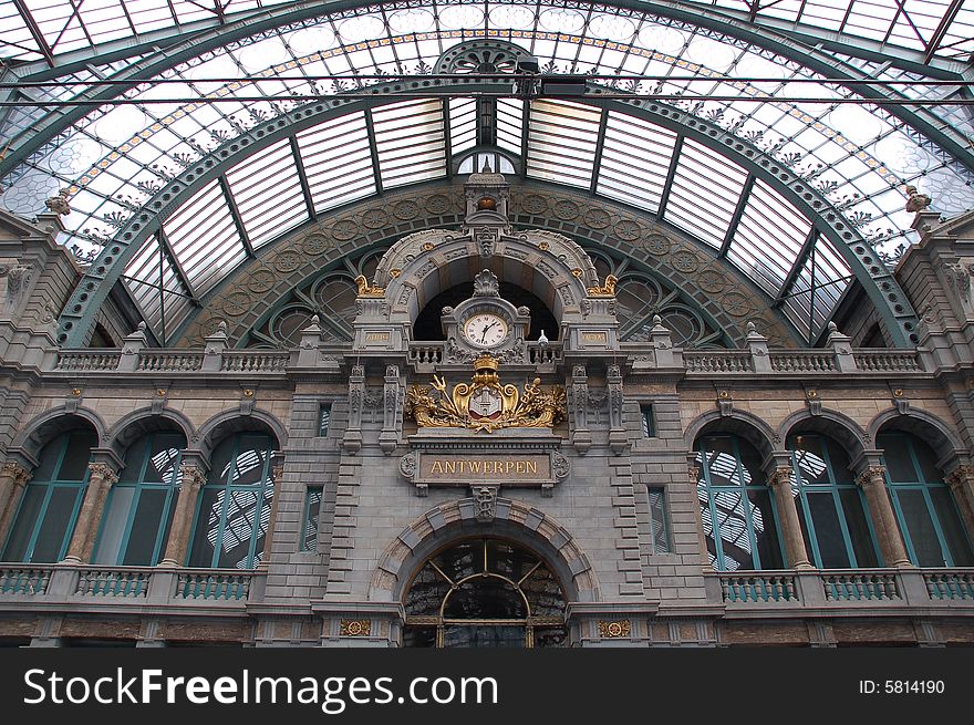 Ancient clock hanging in Antwerp railway station. Ancient clock hanging in Antwerp railway station