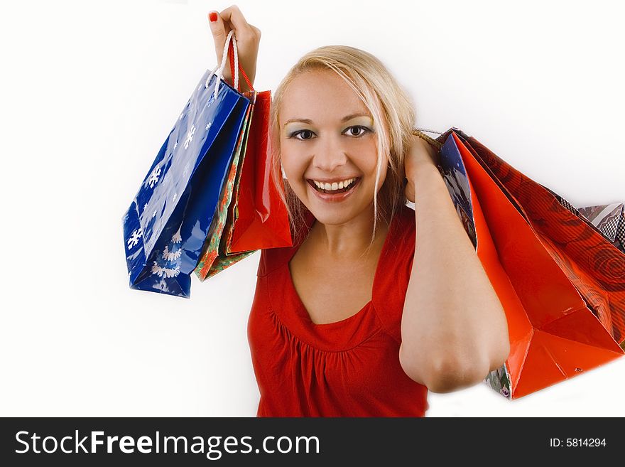 Happy smiling girl shopping - white background