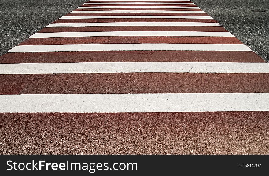 Red and white pedestrian crossing