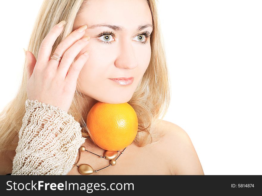 Portrait of a lovely blonde in pullover holding an orange on white background. Portrait of a lovely blonde in pullover holding an orange on white background