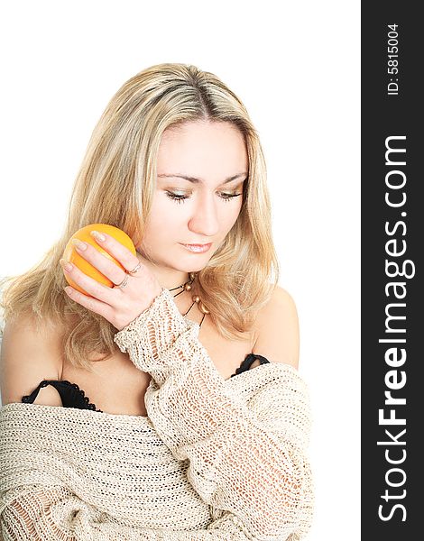 Portrait of a lovely blonde in pullover holding an orange on white background. Portrait of a lovely blonde in pullover holding an orange on white background