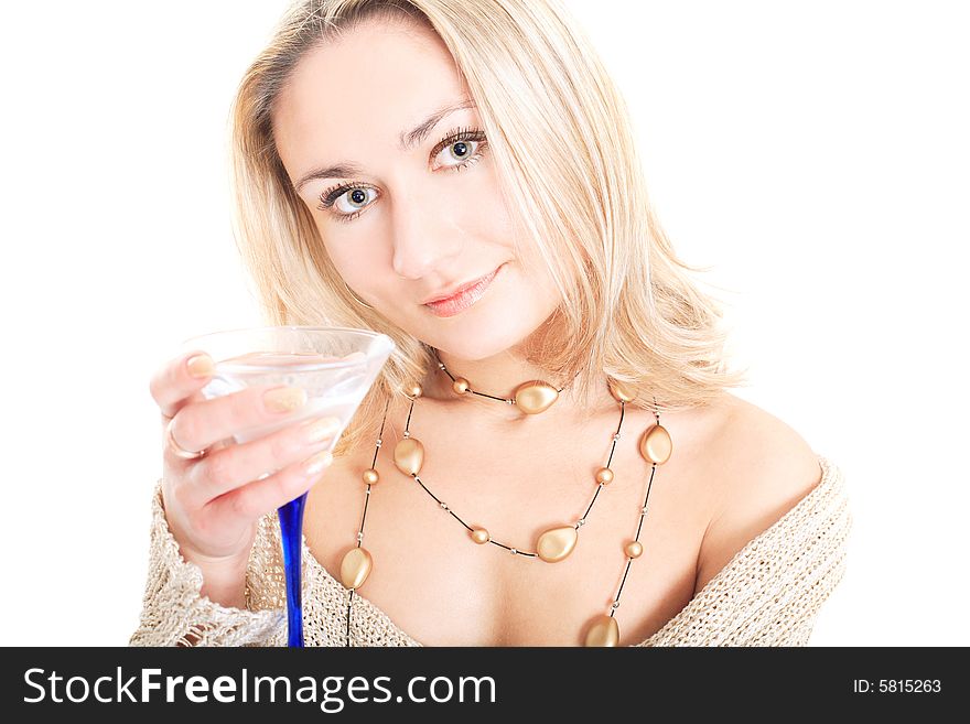 Portrait of a lovely blonde in pullover holding a glass on white background. Portrait of a lovely blonde in pullover holding a glass on white background