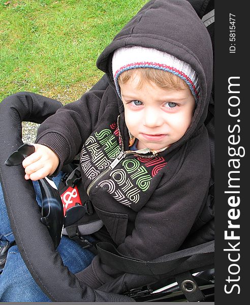 Blue eye boy in a stroller