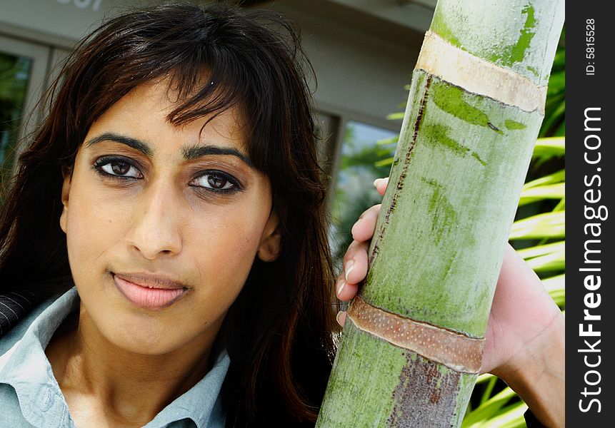 Young Islamic Female Posing For a Headshot next to a Palm Tree