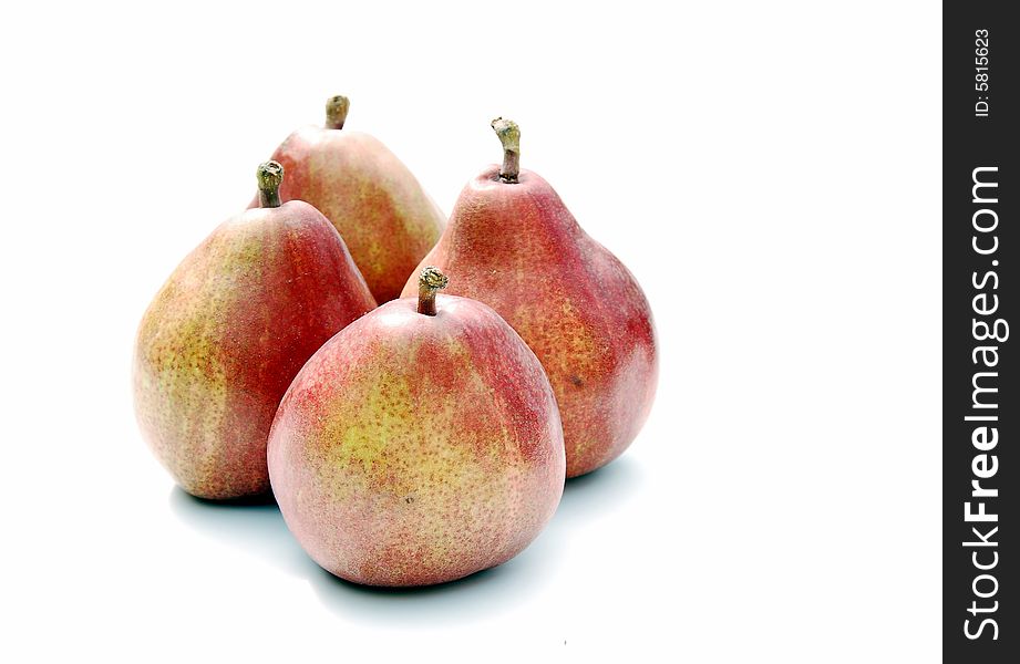 A shot of four ripe pears isolated on white