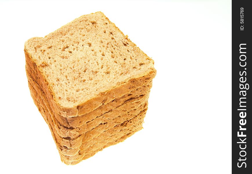 Slices of bread piled on top of each other isolated on white. Slices of bread piled on top of each other isolated on white