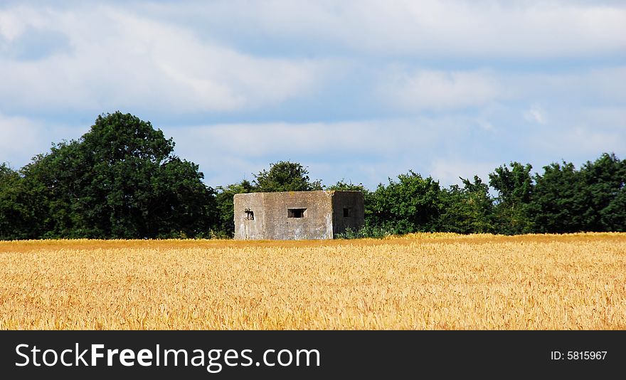 Shot of an old war bunker in a corn field. Shot of an old war bunker in a corn field