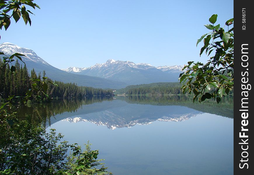 Mirroring view of glacier and mountains on the lake. Mirroring view of glacier and mountains on the lake.