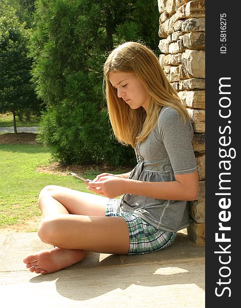 Teenage girl using cell phone